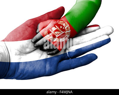 Flag of Netherlands overlaid the hand of an adult man holding a baby hand with the flag of Afghanistan overprinted Stock Photo