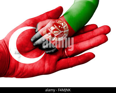 Flag of Turkey overlaid the hand of an adult man holding a baby hand with the flag of Afghanistan overprinted Stock Photo