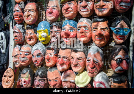 Paper maché masks being sold to place on effigies that will be burn on New Year's Eve. Stock Photo