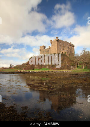 Reflections of Dunvegan Castle in Loch Dunvegan on a sunny day Stock Photo