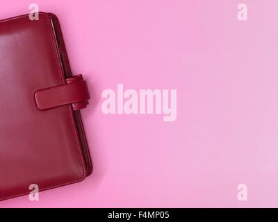 A red leather business notebook binder Stock Photo