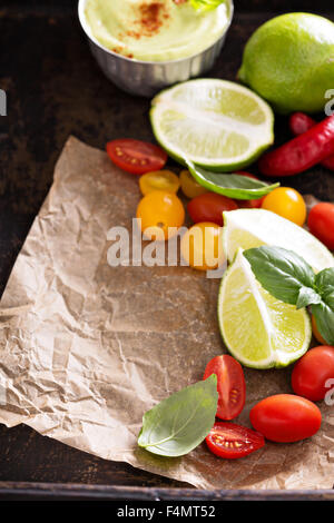 Mexican cuisine ingredients to make avocado sauce and tomato salsa Stock Photo