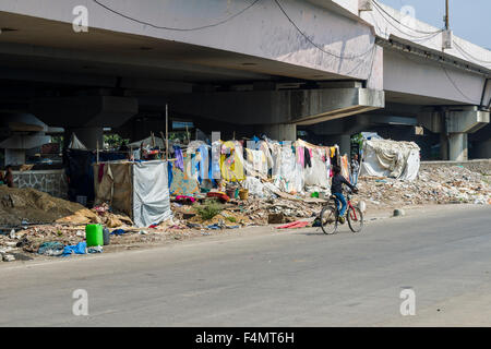 People are living under extrem conditions in tents and huts made from blankets under highway bridges Stock Photo