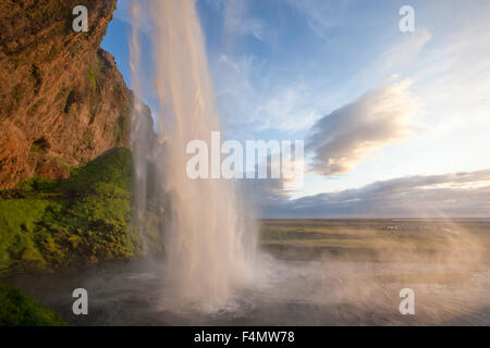 Seljalandsfoss waterfall plunging 60m from the cliff above, Sudhurland, Iceland. Stock Photo