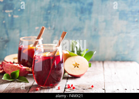 Fall and winter sangria with apples, oranges, pomegranate and cinnamon