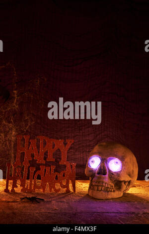 Human skull with fake eyes on dark background Stock Photo - Alamy