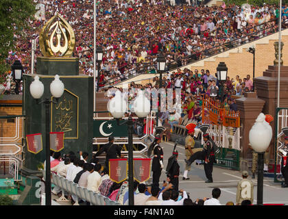 The India-Pakistan Wagah Border Closing Ceremony. The flag ceremony happens at the border gate, two hours before sunset each day Stock Photo