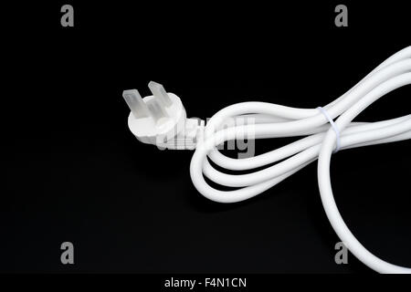 white electric cable on black background Stock Photo