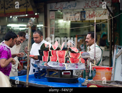 watermelon vendors at the bazar and their clients Stock Photo