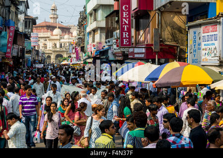 Many people in a crowded street with shops at Mangaldas Market Stock Photo