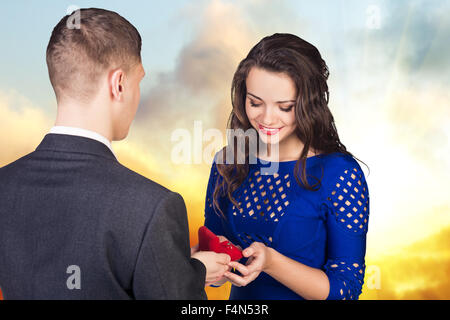 Young man makes a proposal to his girlfriend Stock Photo