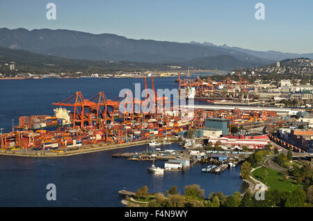 Shipping cranes and container loading docks at the Port of Vancouver, BC, Canada. Container terminal in Vancouver harbour. Stock Photo