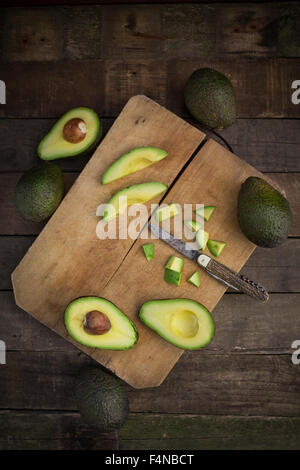 Whole and sliced avocado Stock Photo