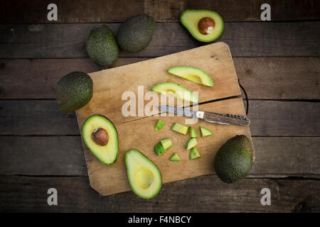 Whole and sliced avocado Stock Photo