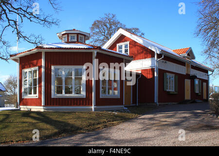 Swedish red houses, is the typical deep red colour in the wooden cottages, found all over the Swedish countryside. Stock Photo