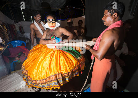 A Katakali artist is getting dressed up as the character Shiva for the play Dhecheyagam Stock Photo