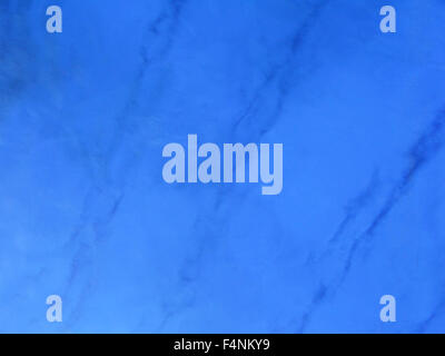 Blue blurry abstract background copy space with dark blue streaks in organic pattern. Stock Photo