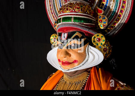 A Katakali artist is posing with the complete make up of the character Shiva for the play Dhecheyagam Stock Photo