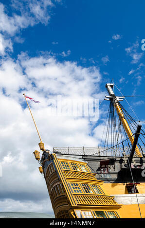 HMS Victory, Lord Nelson's flagship, missing her upper masts due to ongoing restoration at Portsmouth Historic Dockyard, Hampshire, England. Stock Photo