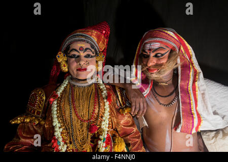 Two Katakali artists are posing with the complete make up of the characters Sathi (left) and Old Brahmin (right) for the play Dh Stock Photo