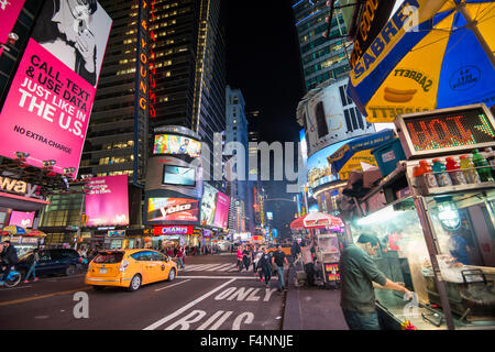 Night time in Times Square, on 42nd Street in Midtown Manhattan, New York City, USA Stock Photo