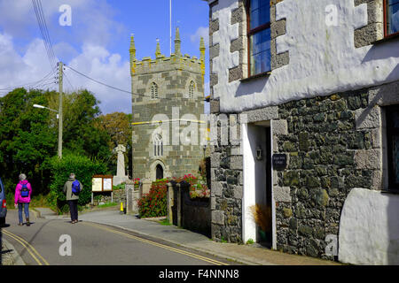 Walkers in Mullion Village, Lizard Peninsula, Cornwall, England, UK in Summer Stock Photo