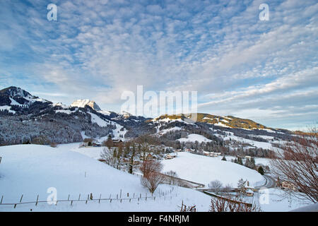 Idyllic winter landscape of Swiss mountains. Region of Gruyere, province of Fribourg, Switzerland Stock Photo