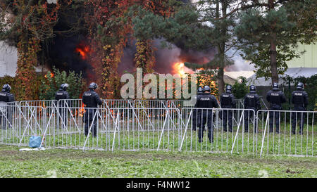 Brezice, Slovenia. 21st Oct, 2015. Slovenia is coping with the large influx of refugees from Siria, Afganistan, Iraq,... On the border with Croatia, in small town Brežice, camp was build to register and transfer refugees. Becouse they weren't happy with situation the set afire the tents. Firefighters were able to put out the fire and police to calm the situation, but almost half of the tens burned out. Credit:  Mitja Mladkovic/Alamy Live News Stock Photo