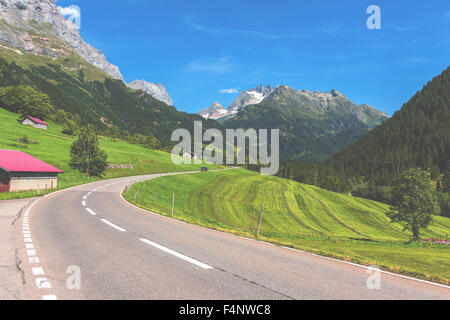 Road Turn in Mountains. Horizontal shot Stock Photo