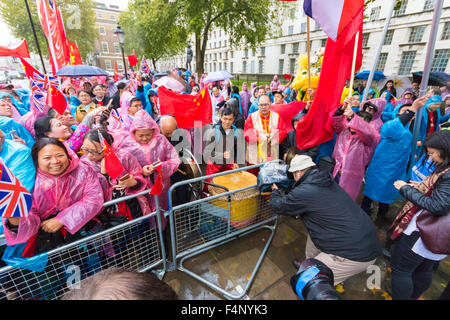 Whitehall, London, October 21st 2015. Hundreds of Chinese supporters waving banners and wearing 'I Love China' T-shirts apparently supplied by the Chinese embassy, face Human rights, Tibetan and Falun Gong protesters as they await the arrival at Downing Street of President Xi Jinpeng. Credit:  Paul Davey/Alamy Live News Stock Photo