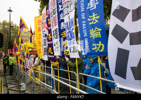 Whitehall, London, October 21st 2015. Hundreds of Chinese supporters waving banners and wearing 'I Love China' T-shirts apparently supplied by the Chinese embassy, face Human rights, Tibetan and Falun Gong protesters as they await the arrival at Downing Street of President Xi Jinpeng. Credit:  Paul Davey/Alamy Live News Stock Photo