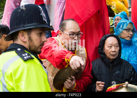 Whitehall, London, October 21st 2015. Hundreds of Chinese supporters waving banners and wearing 'I Love China' T-shirts apparently supplied by the Chinese embassy, face Human rights, Tibetan and Falun Gong protesters as they await the arrival at Downing Street of President Xi Jinpeng. Credit:  Paul Davey/Alamy Live News Stock Photo