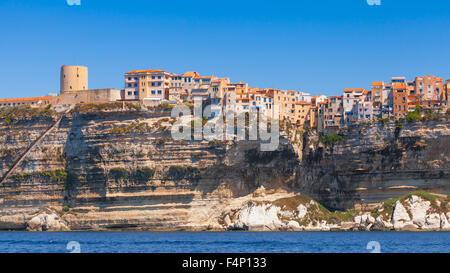 Colorful houses and fortress tower on rocky coast. Bonifacio, Corsica island, France Stock Photo