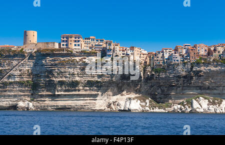 Living stone houses and fortress on the rocky coast. Bonifacio, Corsica island, France Stock Photo