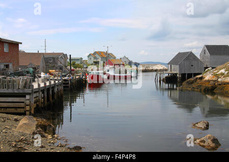 Coastal village of Peggys Cove, Nova Scotia, Canada, showing seaside shacks, fishing boats, and houses along the coast Stock Photo