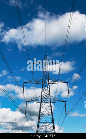 Pylon carrying electricity cables over the countryside in the Cotswolds, Gloucestershire, UK Stock Photo