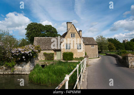 The Mill House next to the bridge over the River Coln in Fairford, Gloucestershire, UK Stock Photo