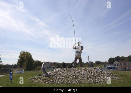 Steel fisherman sculpture on a roundabout in Susmiou France Stock