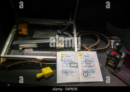 Passport with visas for West-Berlin and FRG and ID check kit including UV control apparatus used by East German STASI officers Stock Photo