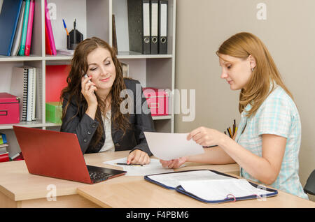 Young beautiful girl on reception at the office specialist Stock Photo