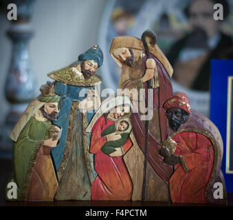 Carved wooden Nativity scene with Jesus in box isolated on white ...