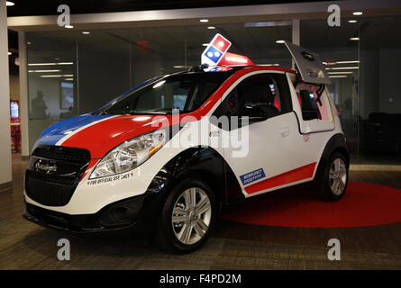 Ann Arbor, Michigan, USA. 21st Oct, 2015. Domino's unveils their DXP delivery vehicle at an Automotive Press Association event at their World Headquarters in Ann Arbor, Michigan on Wednesday, October 21, 2015. Domino's is working with Roush Enterprises to convert and deliver 100 DXPs based on the Chevrolet Spark to 25 markets across the U.S., including Seattle, San Diego, Dallas, Houston, New Orleans, Detroit, Indianapolis and Boston over the next 90 days. Photo by Jeff Kowalsky © Jeff Kowalsky/ZUMA Wire/Alamy Live News Stock Photo