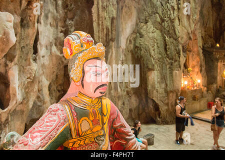 Huyen Khong cave on Thuy Son marble mountain with painted sculpture and tourist visitors,Da Nang,Vietnam Stock Photo