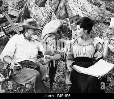 On the set, Sam Peckinpah with Senta Berger / Major Dundee / 1965 directed by Sam Peckinpah [Columbia Pictures]