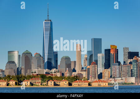 Downtown New York skyline with Ellis Island in the foreground Stock Photo