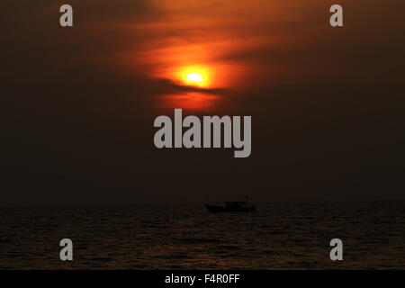 Sunset and a boat Stock Photo