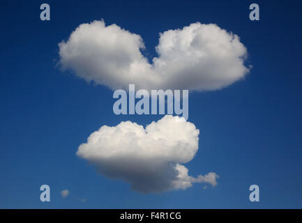 Heart-shaped clouds in the sky Stock Photo