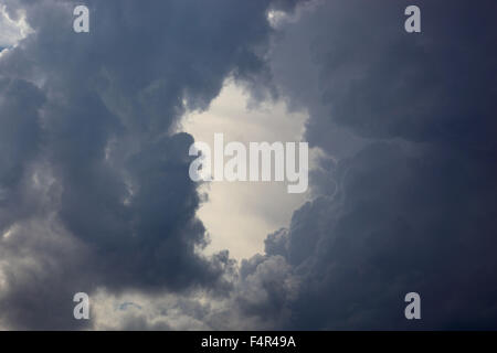 Hole in the clouds, storm clouds Stock Photo