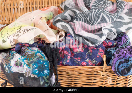 Woman scarfs in a wooden basket Stock Photo