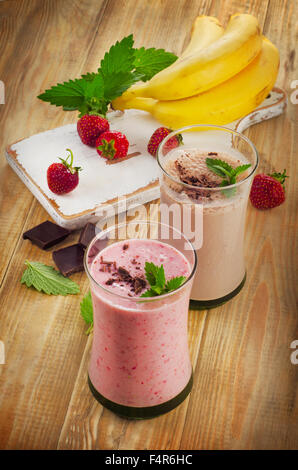 Smoothies with  strawberry and banana on  a wooden table. Selective focus Stock Photo